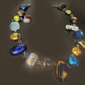 Gorgeous dichroic gems in 18-piece necklace. 19"